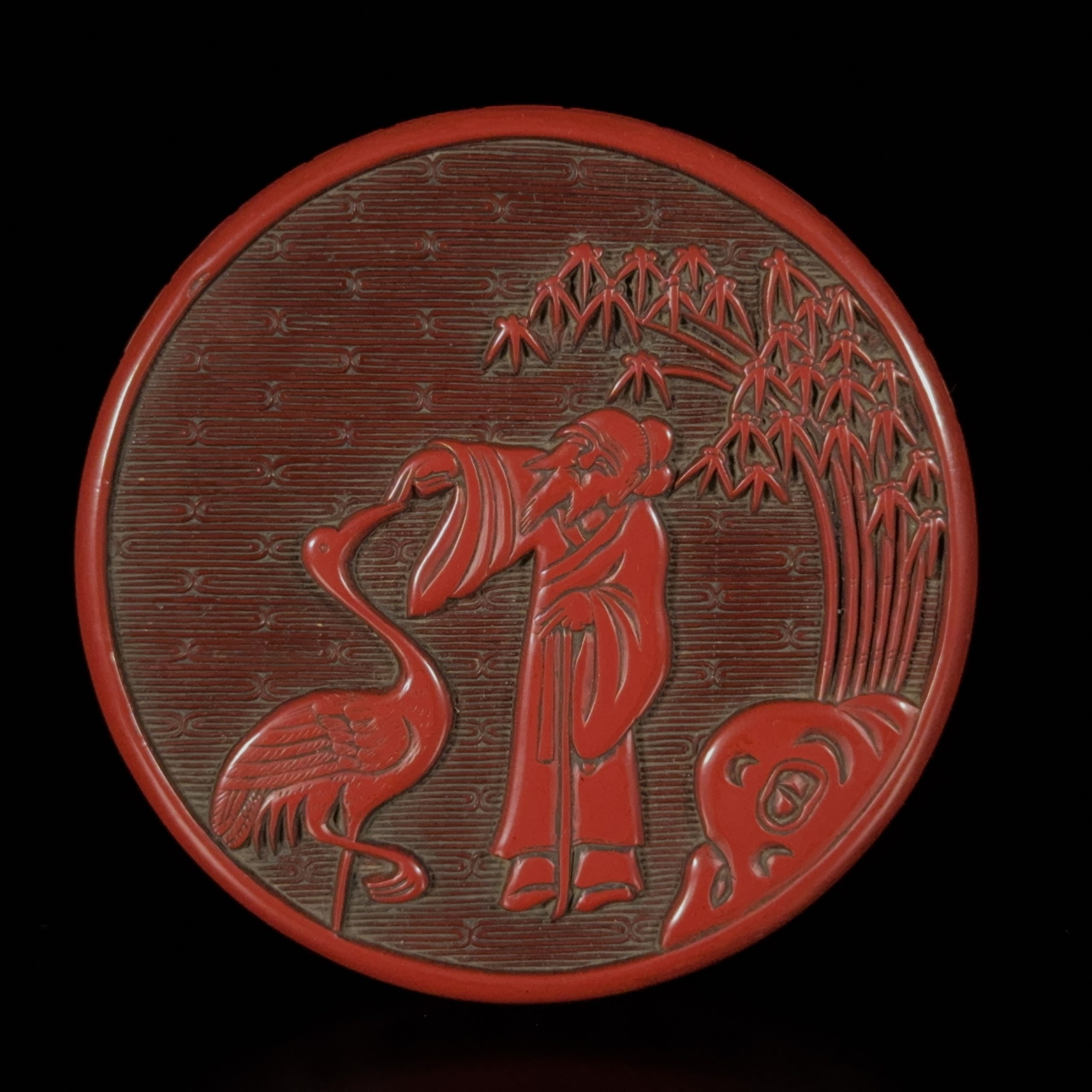 35178	剔紅雕 鶴仙人紋 圓盒